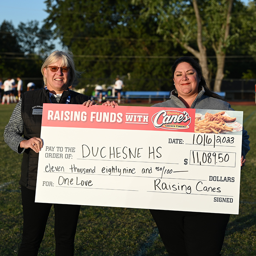 DHS President is presented check from Cane's