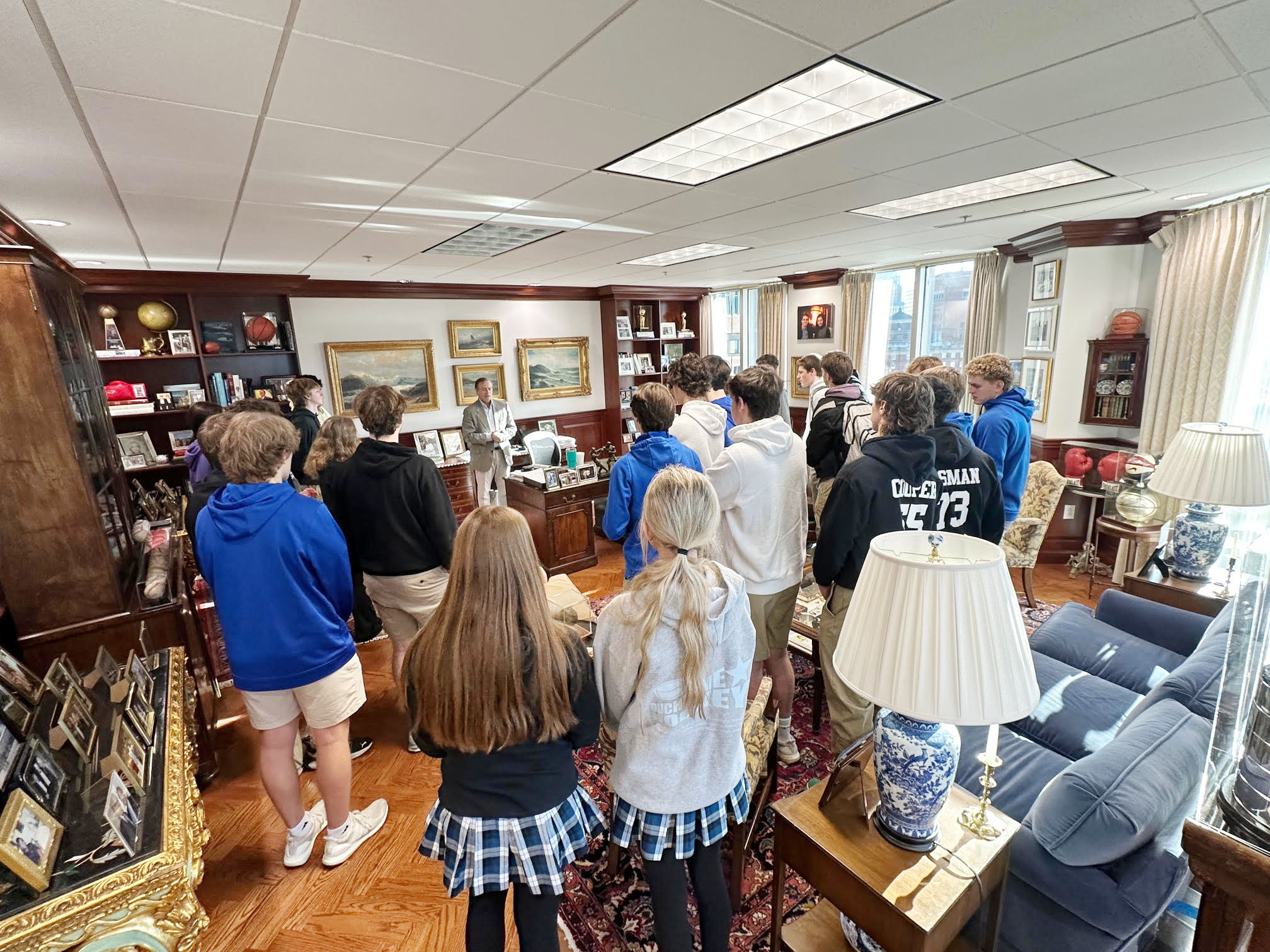 Benjamin F. Edwards CEO Tad Edwards takes Duchesne students' questions in his office.